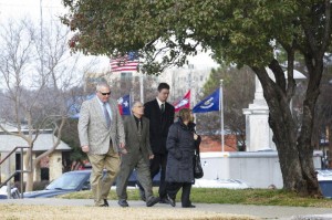 Staff photo by Evan Lewis The parents of Seth Calagna, one of two men owed a $30 million judgment by Tony Alamo, walk with other Alamo loyalists into the federal courthouse Wednesday for a hearing concerning properties in Fouke, Texarkana and Fort Smith, Ark.